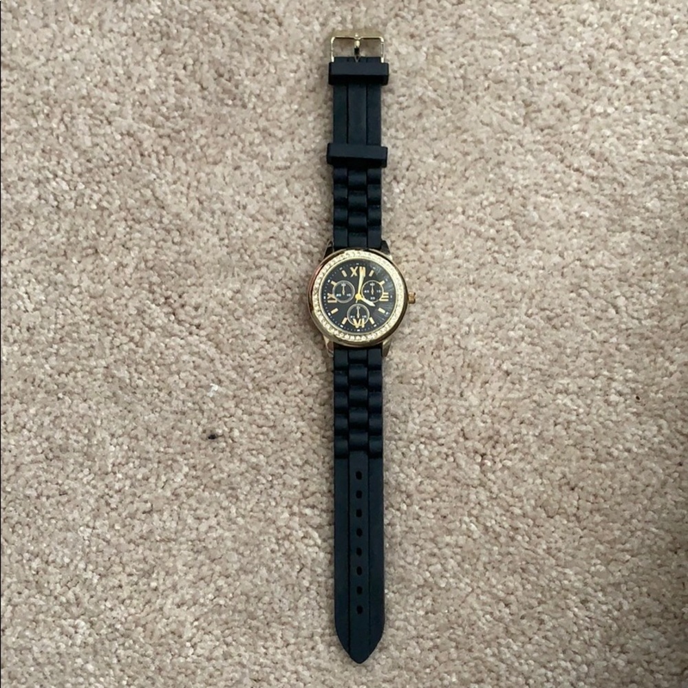 Black and gold rubber watch